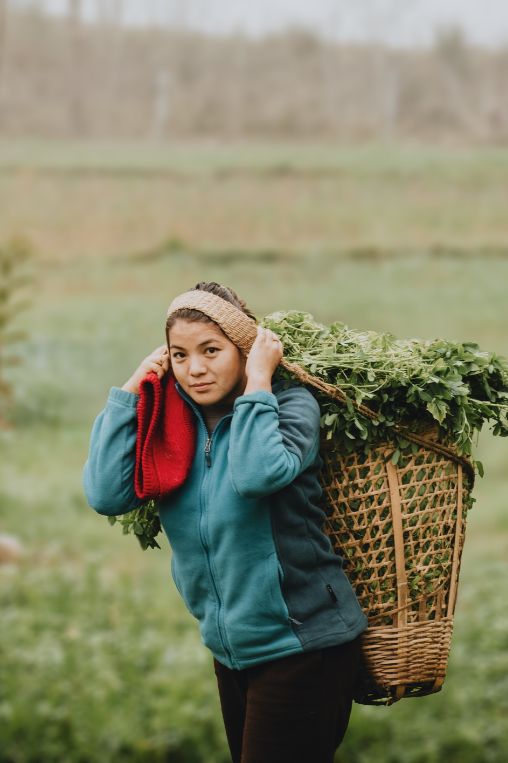 Girl carrying doco Nepal