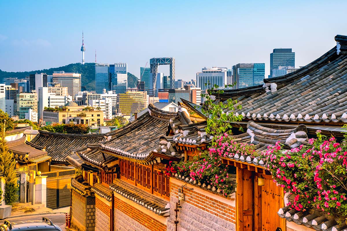 Bukchon Hanok Village with Seoul city skyline in distance