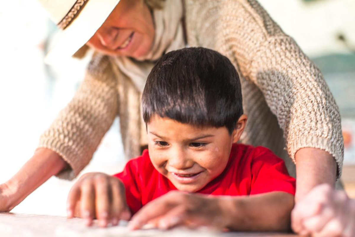 Petit with one of her pupils at the Sol Y Luna Foundation