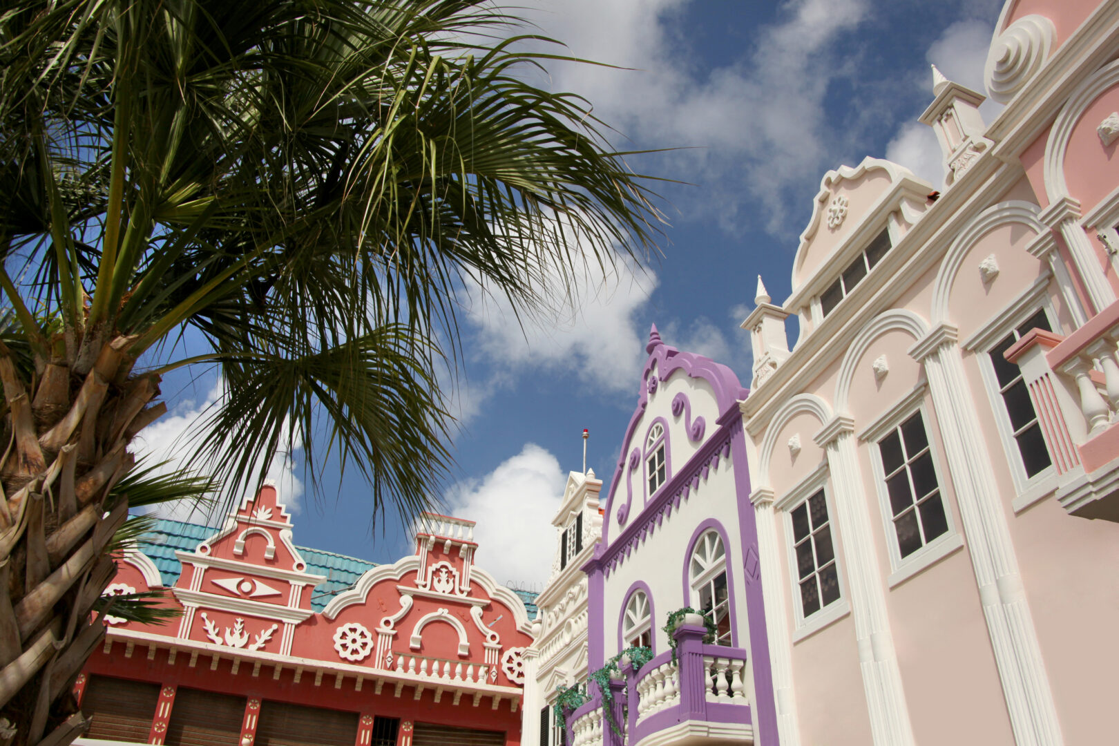 Typical pink, purple and red pastel painted architecture of Aruba, Curacao and Bonaire, Caribbean.
