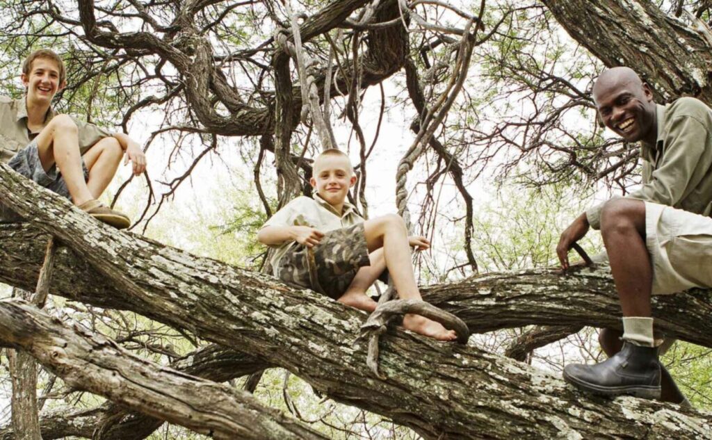 Climbing a tree with children in the Okavango Delta