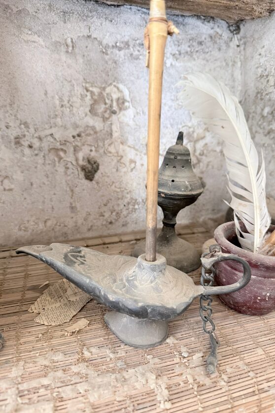 An old oil lamp, quill and incense burner preserved in a monastic cell in Wadi El Natrun.