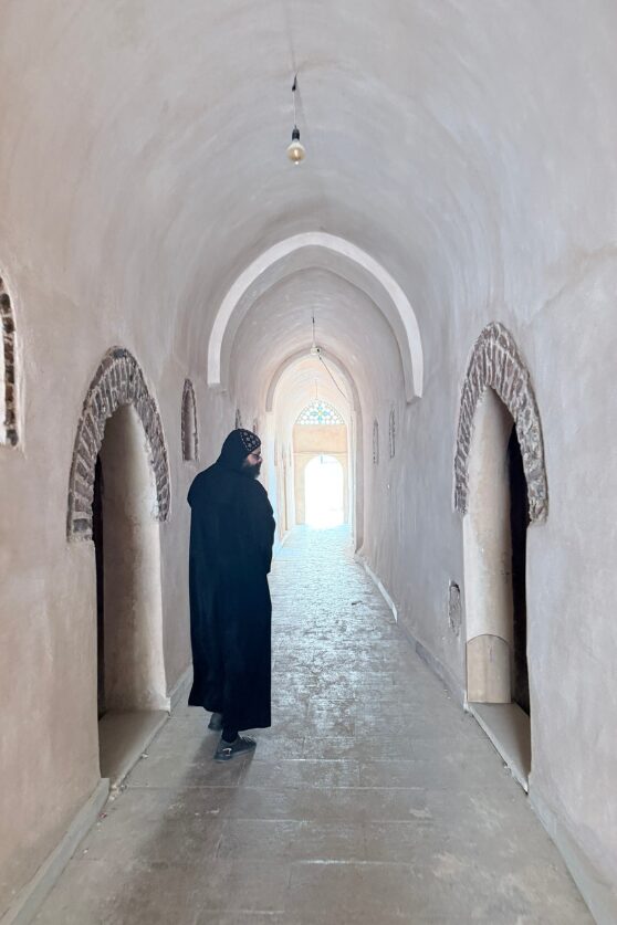 Father Bishoy leads the way at Abu Makar Monastery