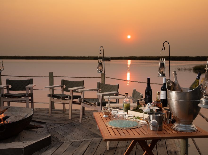 Sundowners by the water at Sitatunga Private Island Camp in the Okavango Delta