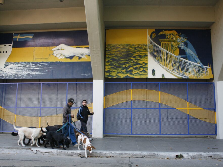 Dog walkers near the Bombonera football stadium