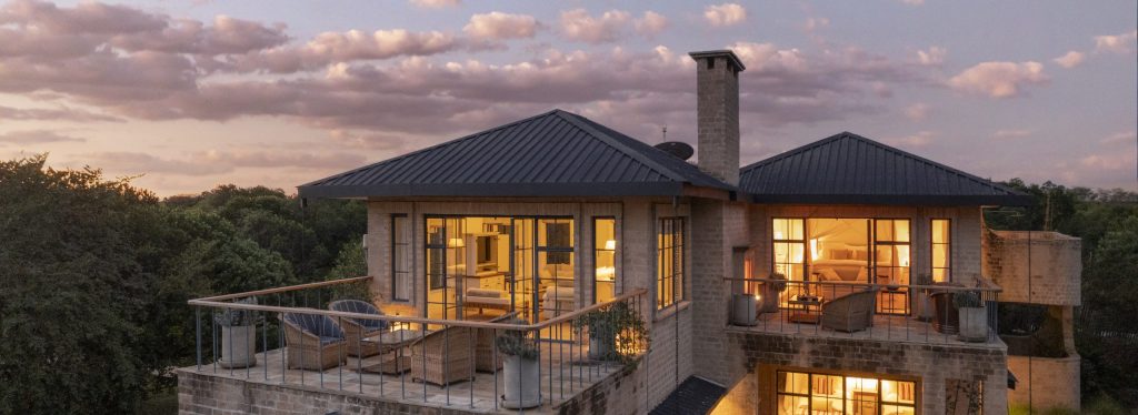 Amani House exterior at sunset, in the Maasai Mara