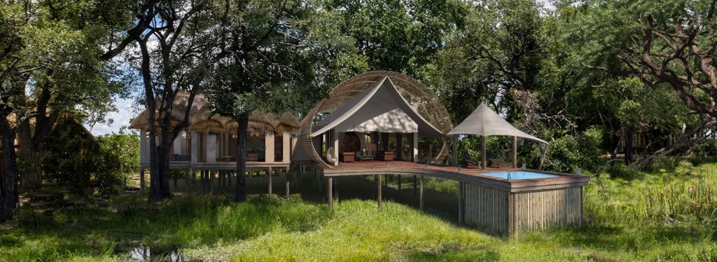 Sitatunga Private Island Camp, surrounded by wetlands and trees with a sitatunga antelope nearby.